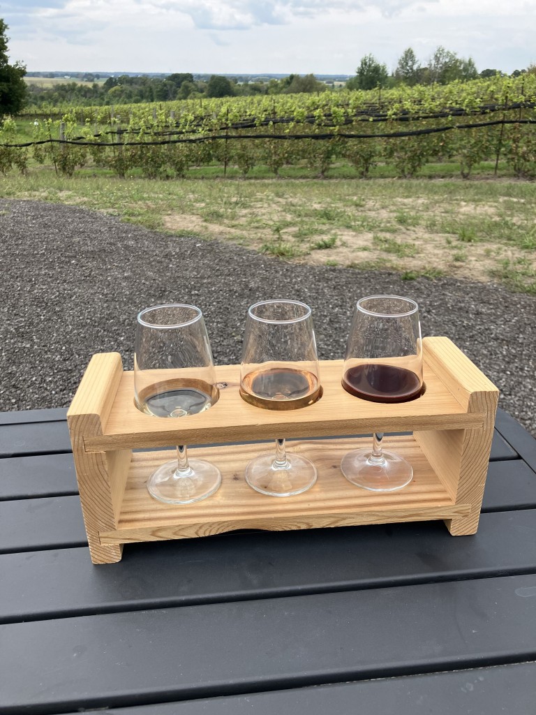 A flight of three wine samples at Kin Vineyard and Winery is tastefully priced at $12.  Photo by Jill Wherrett 